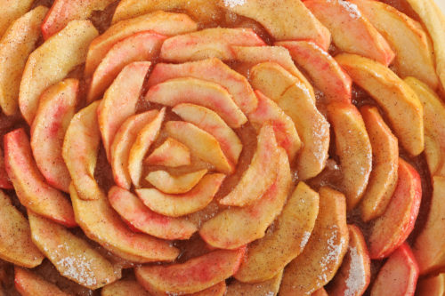 background of toppings Apple cinnamon pie - top view